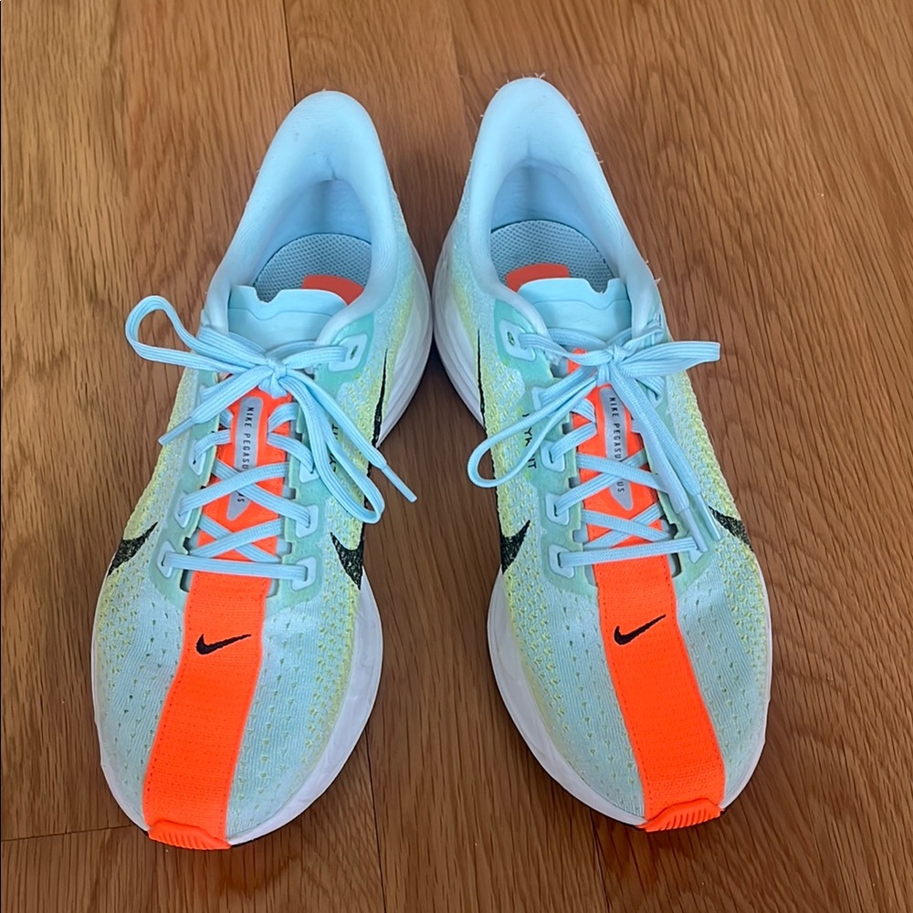 Nike Running Shoes with Orange and Blue Accents